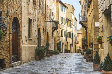 Naklejka na ściany i meble Walk on a rainy day through the streets of the beautiful town, Pienza, Tuscany