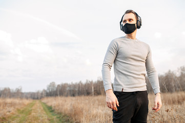 Healthy lifestyle. Guy in a black medical mask