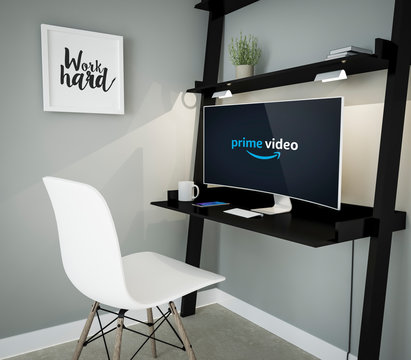 curved monitor workplace with Amazon Prime Video