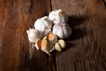 Garlic on a wooden background. Food on table.