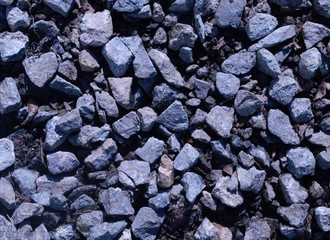  gray background made of small stones lying on the ground