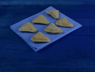  fresh cookies laid out in a rectangular shape on a table
