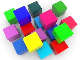 Obraz premium Colored toy cubes scattered on a white background