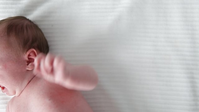 little newborn baby watching ,crying  with sound