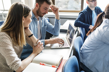 College students listen to professor's lecture in class room.	