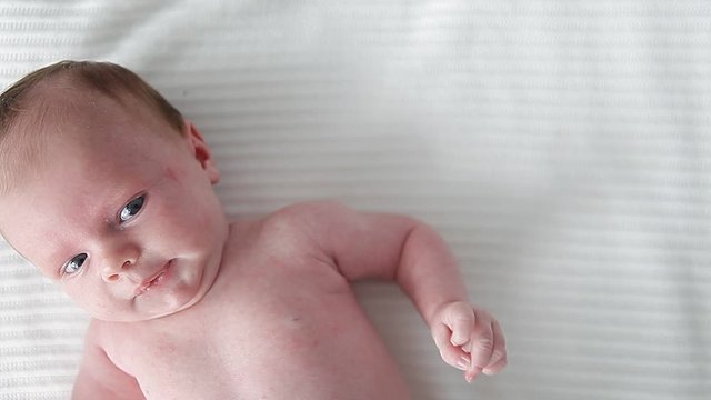little newborn baby watching ,crying  with sound