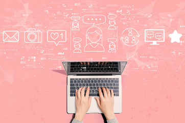 Social media theme with person using a laptop computer - obrazy, fototapety, plakaty