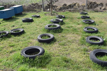 Kherson, Ukraine, 03/26/2020. Stands for evidence in the garden of car tires.