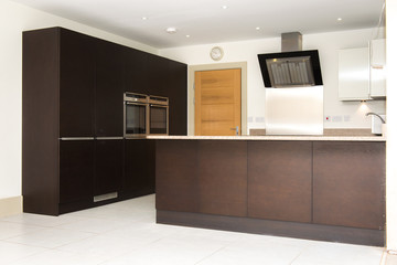 Nice high standard kitchen with dark furniture, in the English style