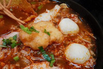 Close up spicy noodles soup with pork also known as Tom Yum, Thai food.