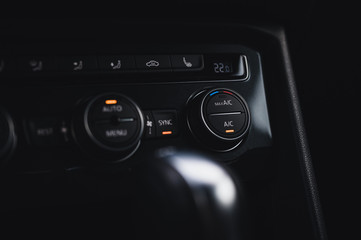 Color detail with the air conditioning button inside a car. Car interior. Car air condition.