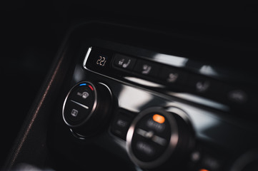 Color detail with the air conditioning button inside a car. Car interior. Car air condition.