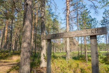 Wooden sign along the hiking trail in Hailuoto island, Finland

