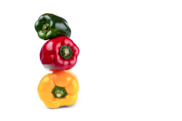 Sweet red, yellow and green peppers isolated on white background