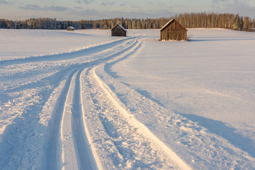 Old barns in snowy field