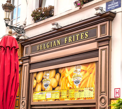Brussels, BELGIUM - July 7, 2019: classic Belgian frites with choice of sauces, plus burgers and snacks in Brussels, Belgium