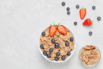 Multigrain wholewheat healthy cereals with fresh berries strawberries and blueberries. Healthy breakfast.