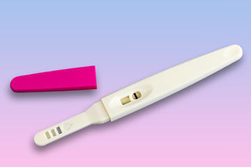Pregnancy test isolated on gradient background from blue to pink