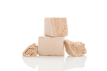 Yeast cubes for bread making isolated on white background.