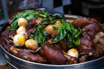 Steamed pork legs with boiled eggs in a big stew pot