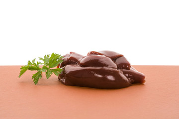 Raw chicken liver with fresh parsley.