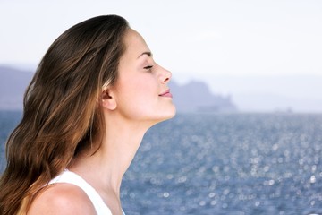 Happy young woman with perfect skin on outdoor background