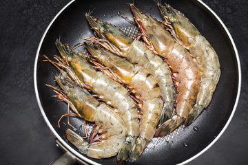 Prawns Shrimps roasted on frying grill pan cooking in kitchen