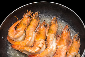 Prawns Shrimps roasted on frying grill pan cooking in kitchen