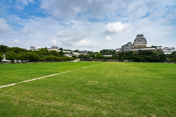 Scenic green meadow around Himeji Castle, one of the most famous historical landmark of Japan