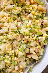 fresh potato salad with corn, celery, and fresh ingredients