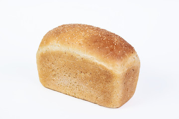 Bakery product. Fresh white molded bread with sesame seeds isolated on white background. Top view and copy space for text.