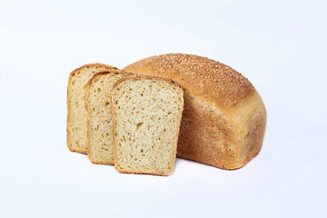 Fresh bakery product. Bread. Whole grain white bread with sesame seeds isolated on white background. Top view and copy space for text.