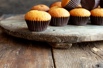 Muffins - delicious pastries. Delicious dessert on the table - homemade muffins. Portioned cupcakes. Simple muffin.