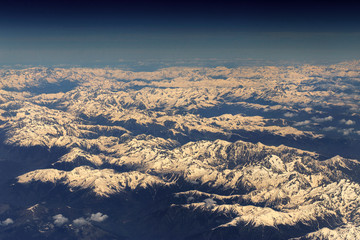 Aerial view of mountains with snow on top