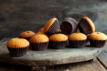 Muffins - delicious pastries. Delicious dessert on the table - homemade muffins. Portioned cupcakes. Simple muffin.