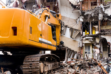 Bulldozer demolishes old buildings.  demolition of a building in the harbor area in Turkey, istanbul