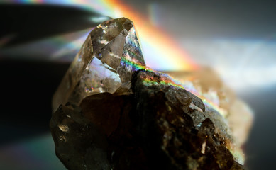 Amazing natural light reflections on healing Smokey Quartz wild jewels. Texture of gemstone with...
