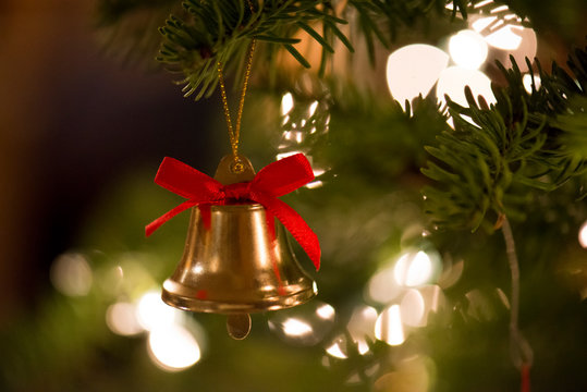 Christmas tree with bells and stars at christmas time with lights and beautiful colors