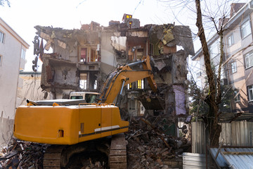 Bulldozer demolishes old buildings.  demolition of a building in the harbor area in Turkey, istanbul