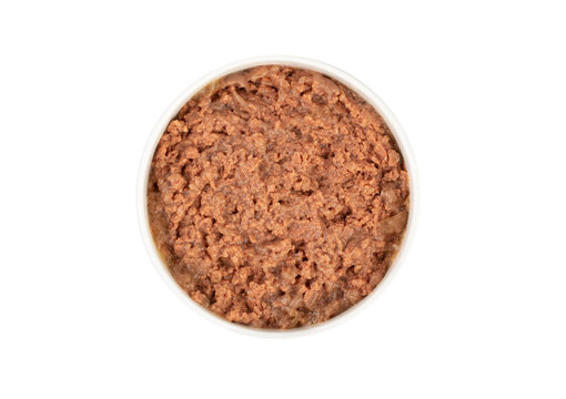 Canned pet food in round white bowl isolated on white, top view.