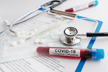 Blood sample, stethoscope and thermometer
