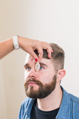 Medicine, health, ophthalmology concept - Ophthalmologist examines patient's eyes.