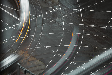 Fast blurred trail of train in traffic motion in illuminated metro, Netherlands.