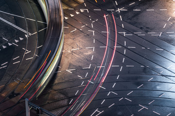 Fast blurred trail of train in traffic motion in illuminated metro, Netherlands.