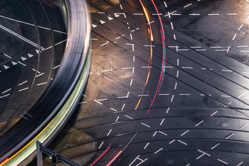 Fast blurred trail of train in traffic motion in illuminated metro, Netherlands.