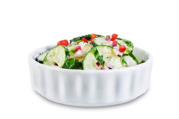 Cucumber spice salad with red onion nd red pepper on a white isolated background