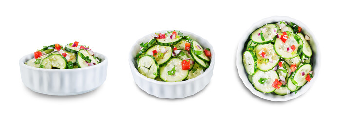 Cucumber spice salad with red onion nd red pepper on a white isolated background