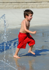 Boy Dashing About Water Park