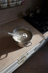 Pancake dough on a table in the kitchen