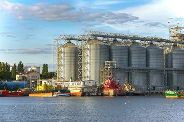 Port terminal. Merchant shipping. Complexes for drying and storing grain. cargo ship. Container...
